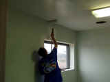Gary painting the ceiling in Audra's office