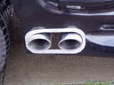 Closeup of custom exhaust exiting through Magnaflow polished tips