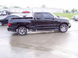 Side view of truck with custom 3" exhaust