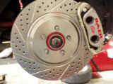 Baer cross-drilled and slotted rotor and caliper