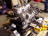 K20 engine on new subframe with turbo, lsd, and pulleys ready to install