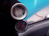 Closeup of Autometer boost and air/fuel ratio meters mounted into gauge pod