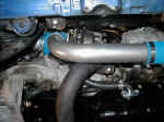 GReddy downpipe connected to GReddy 18G turbocharger