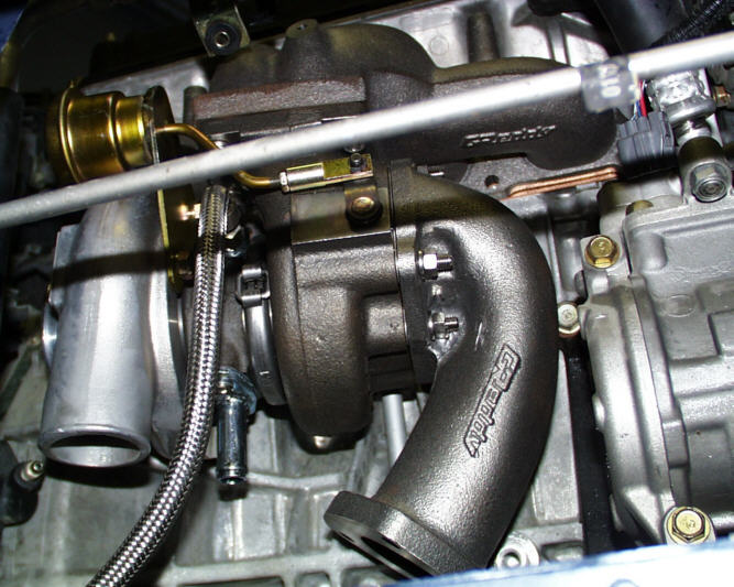 Closeup of GReddy TD05-18G turbo charger mounted to B16 engine