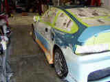 Left side masked....side skirts have an extra flare molded in now....rear bumper flare molded in now