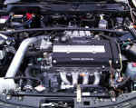 Engine view showing AEM cold air intake and DC Sports ceramic coated header on a 2001 Acura Integra GSR