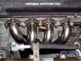 GReddy stainless steel header installed on Acura Integra GSR engine