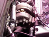 Closeup of GReddy turbocharger mounted to manifold