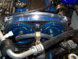 Fidanza cam timing gears with GReddy timing belt visible through clear timing cover after installation