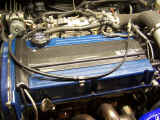 Custom blue valve cover with Carbign Craft carbon fiber coil cove