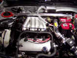 Engine view with new AEM intake system and GReddy oil catch can installed