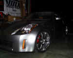 Front quarter view of Z after caliper painting, Eibach spring installation, and Volk Racing GT-7s