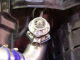 Closeup of GReddy Type S BOV installed on compression pipe