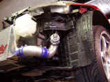 GReddy windshield washer reservoir and GReddy Type S BOV on left side of vehicle