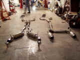 Front y-pipe and RS-R exhaust system on left compared to new Espelir JGT500 true dual exhaust on right