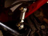 Closeup of Hotchkis rear sway bar mounted with Hotchkis sway bar end link with spherical bearings