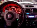 Dash lit up with GReddy turbo timer and JVC CD with blue screen
