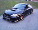 Front quarter view after work was completed, notice new GReddy front lip