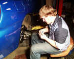 Ryan (WyoTech grad, now working at Pontiac) sealing fittings to adapt WRX rear brake lines to Wilwood 4 piston caliper